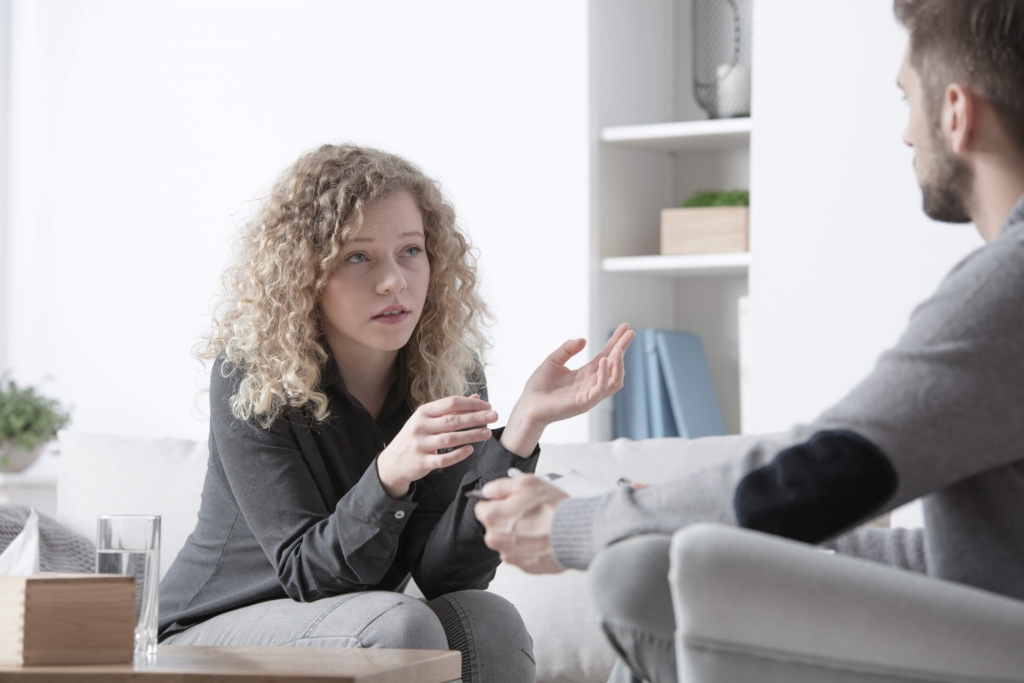 young couple communicating and help dealing with girlfriends depression